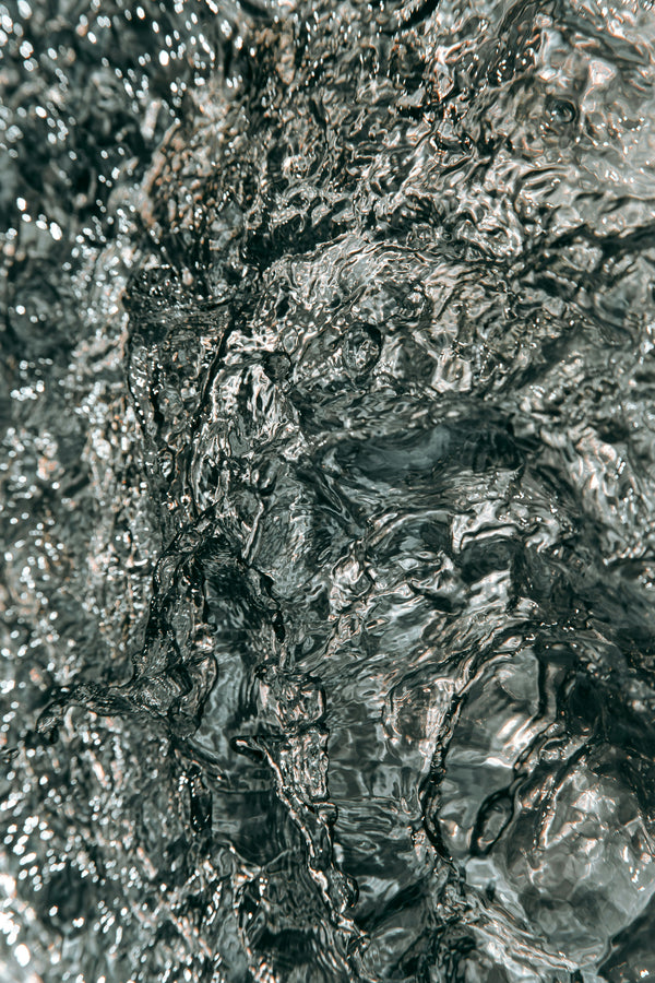 Close up of a textured magnesium stone surface showing natural mineral detail